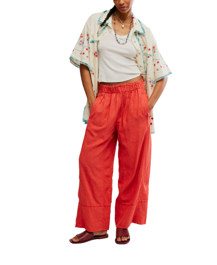 Day's End Linen Pull-On Pants in Poppy Red by Free People, featuring a mid-rise, wide-leg fit, pull-on design, and side pockets.