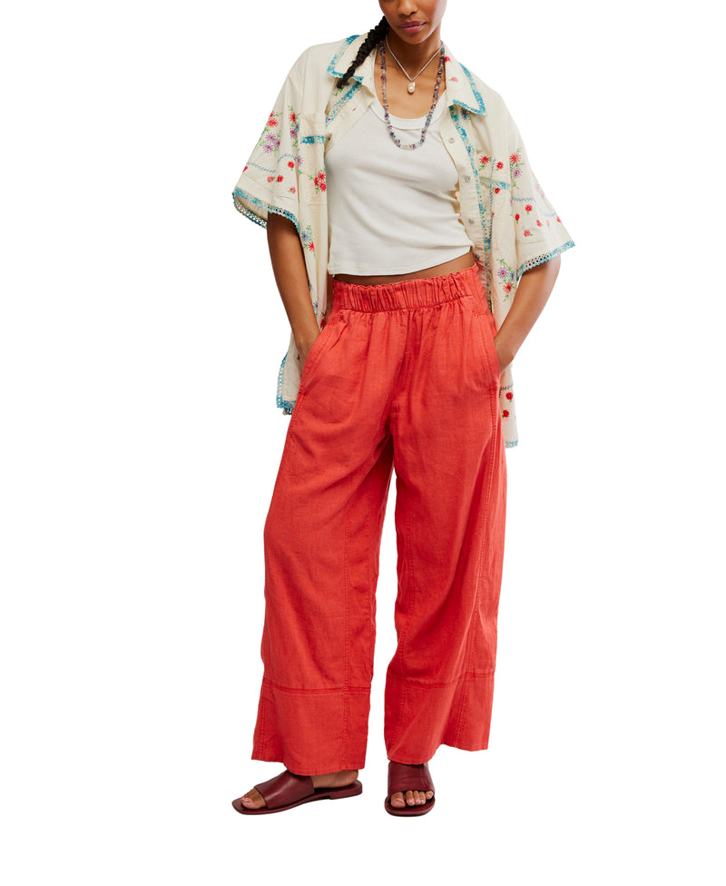 Day's End Linen Pull-On Pants in Poppy Red by Free People, featuring a mid-rise, wide-leg fit, pull-on design, and side pockets.