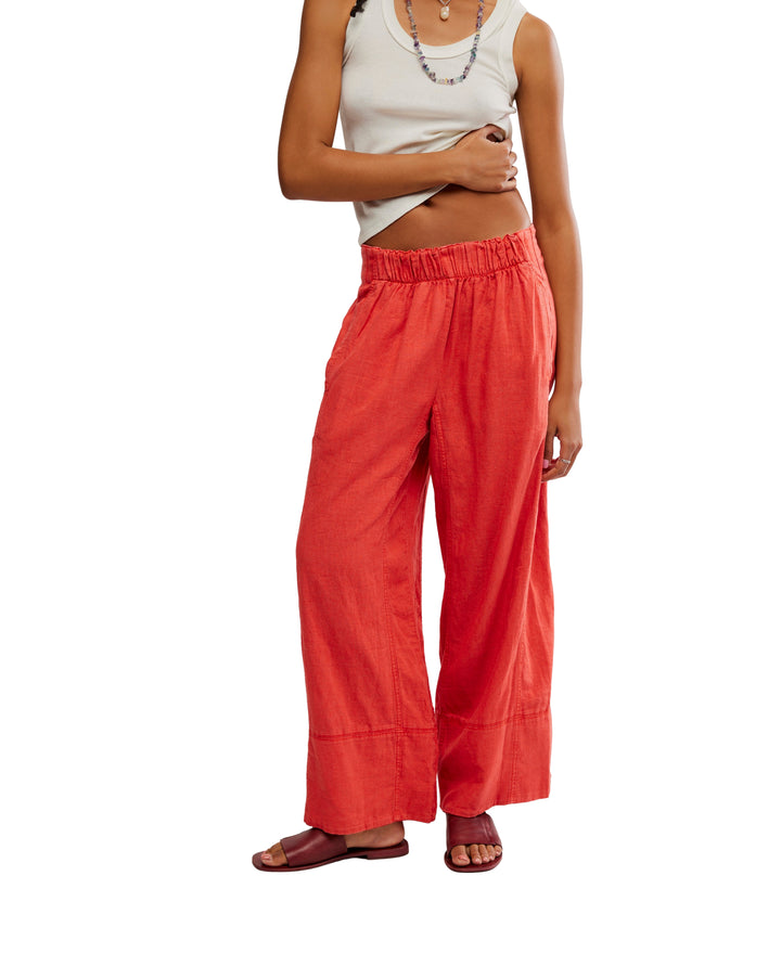 Day's End Linen Pull-On Pants in Poppy Red by Free People, featuring a mid-rise, wide-leg fit, pull-on design, and side pockets.