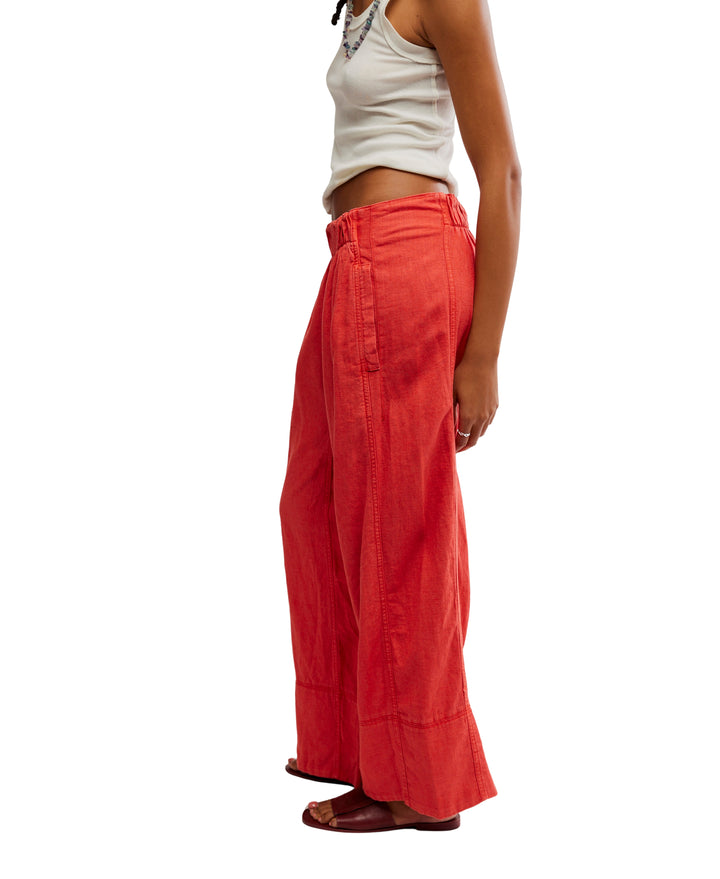 Day's End Linen Pull-On Pants in Poppy Red by Free People, featuring a mid-rise, wide-leg fit, pull-on design, and side pockets.