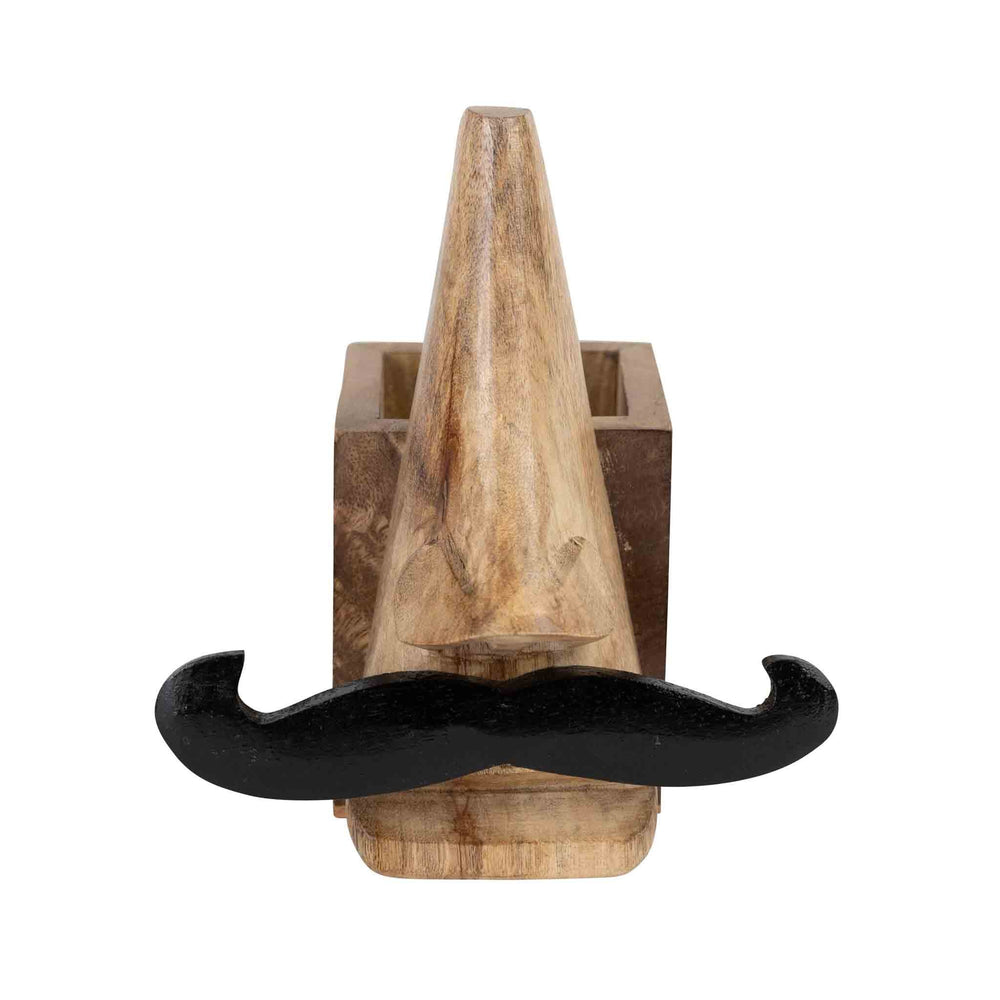 Handcrafted eyeglass and pencil holder made from sustainably sourced mango wood. Features a playful mustache face design in natural and black finishes. Measures 5.5" high with a 2.5" square base. Eco-friendly and easy to clean.